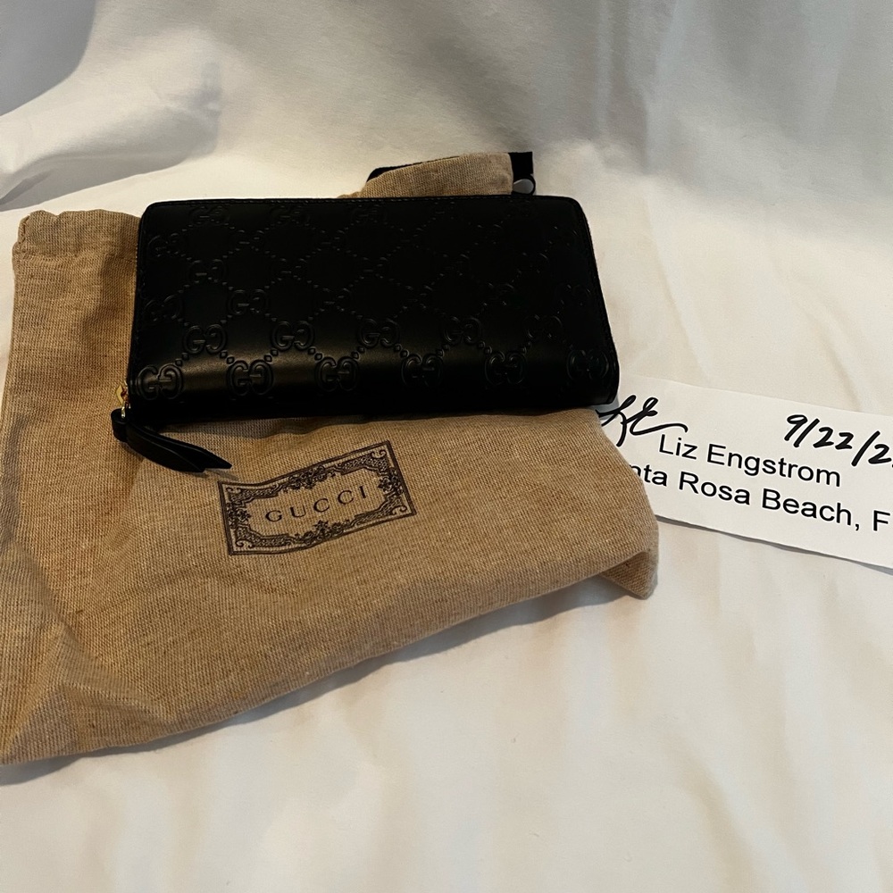 Gucci Black Wallet now used but not much. It just was too big for my small purse